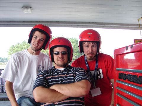 1994 Ford Probe - Three friends wearing red helmets are ready for some action, standing next to a red toolbox.