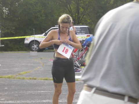1991 Ford Bronco - A woman prepares for a race, with a white SUV visible in the background.