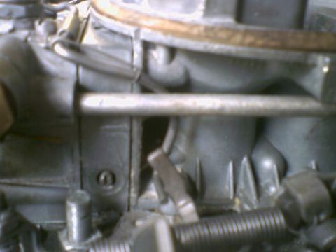 1972 Ford Ranchero - This is a close-up view of a vehicle's carburetor, showing intricate mechanical components.