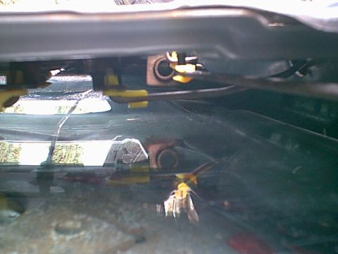 1983 Ford Bronco - this is a shot from drivers side access hole. you can see the handle rod (coming from the right to the center)