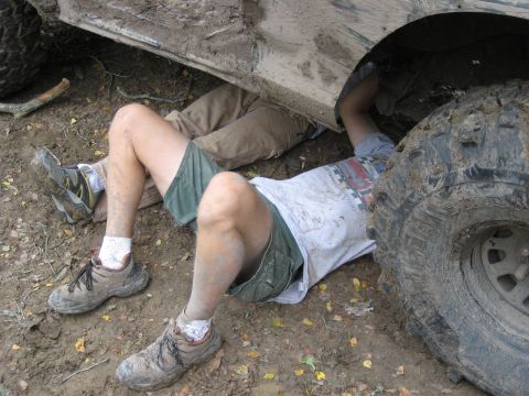 1986 Ford Bronco - under the truck diagnosing the damage after the break on the hill climb