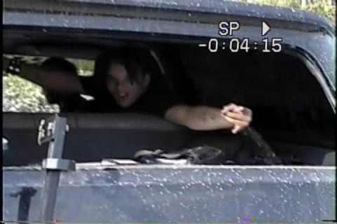 1989 Ford Bronco - People inside a vehicle, with a timestamp visible on the recording.