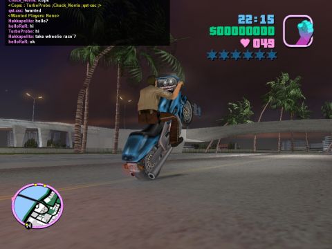 1990 Ford Probe - Video game scene with a character performing a wheelie on a motorcycle at night.