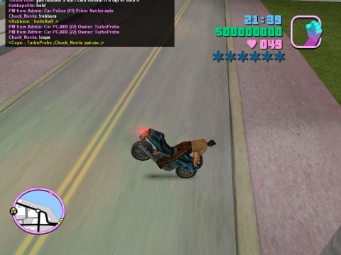 1990 Ford Probe - A video game screenshot shows a motorcycle performing a wheelie on a street, complete with in-game statistics.