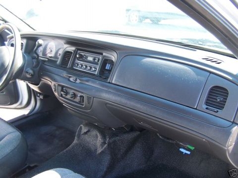 2003 Ford Crown Victoria - Dashboard of a 2003 Ford Crown Victoria, the instrument panel and center console.