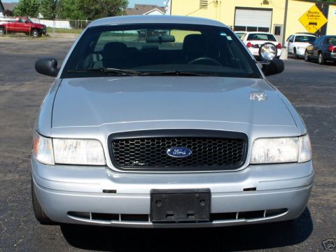 2003 Ford Crown Victoria - Front view of a silver 2003 Ford Crown Victoria, showing its distinctive grille and headlights.