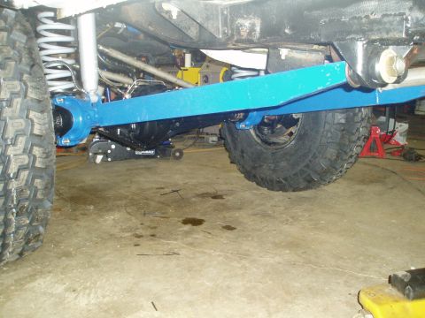 1969 Ford Bronco - Close-up of vehicle undercarriage components, including suspension and axle parts.