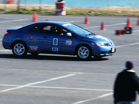 2001 Mercury Grand Marquis - Blue Honda Civic coupe participating in an autocross event on a sunny day.