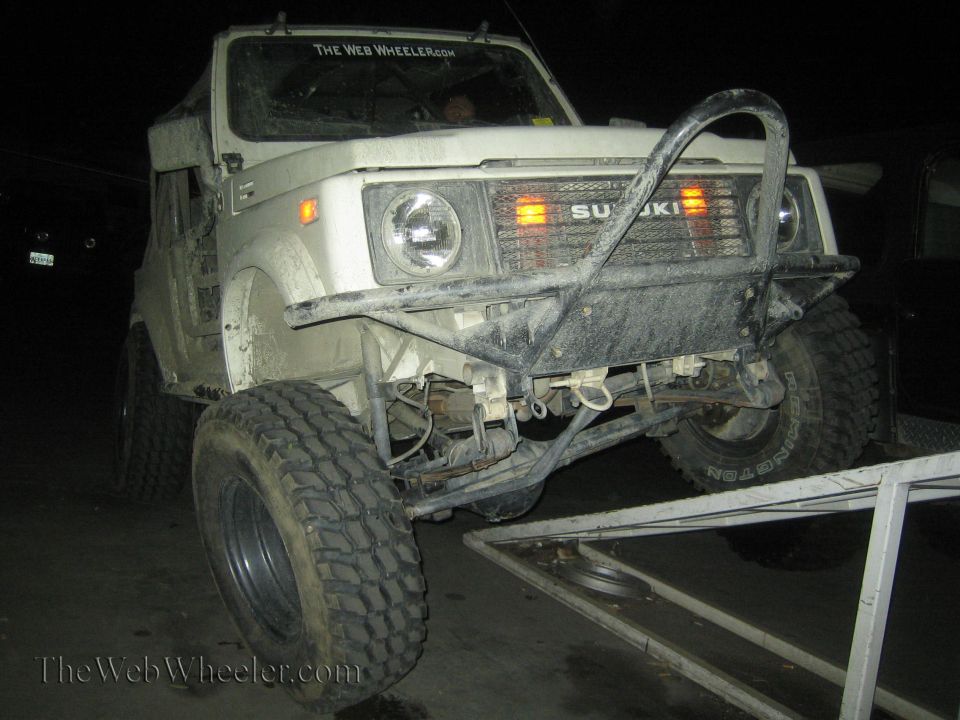 1987 Suzuki Samurai front view with aftermarket bumper and large tires