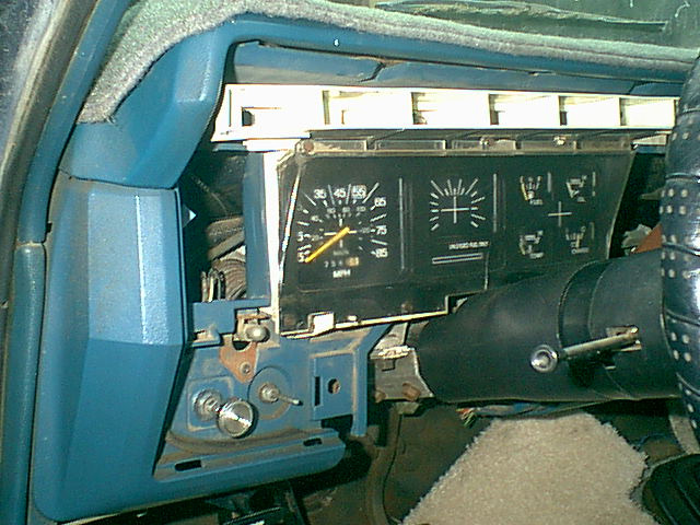 You have to remove the bezel. to do so the head light switch knob and windshiel wiper knob must come off. this is the stock cluster. still no tac