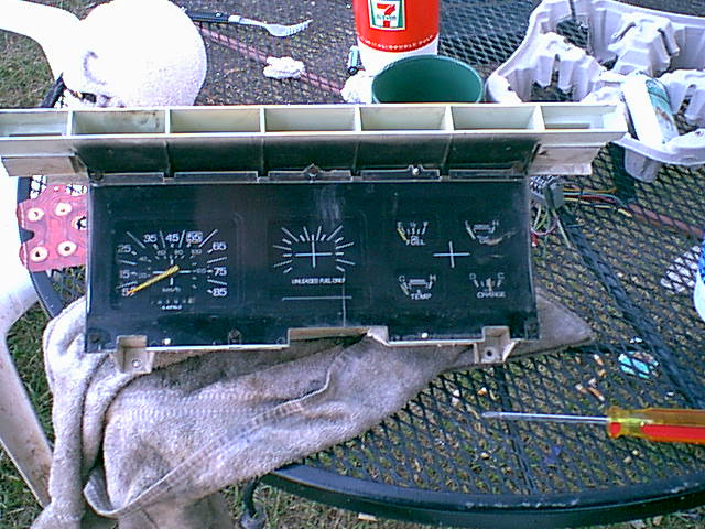 it was easier for me to complete this swap at the table. here is the stock cluster.(Mine has a crack in the middle it came this way so i wanted to swap it out too.