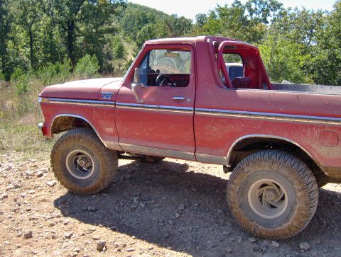 1978 Ford Bronco - This red 1978 Ford Bronco features diamond plate trim along the lower body and in the truck bed.