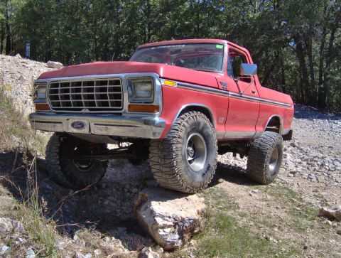 1978 Ford Bronco - This red 1978 Ford Bronco is navigating a rocky, off-road trail.