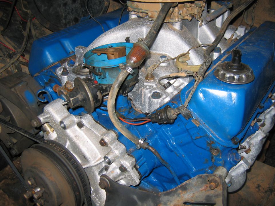 Blue painted engine with silver intake manifold and distributor cap