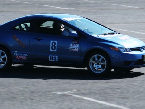 2001 Mercury Grand Marquis - A blue coupe with racing decals and the number 8 is on the track.