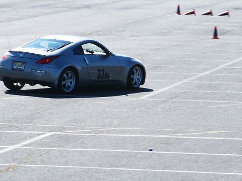 2001 Mercury Grand Marquis - A silver coupe navigates an autocross course marked by traffic cones.