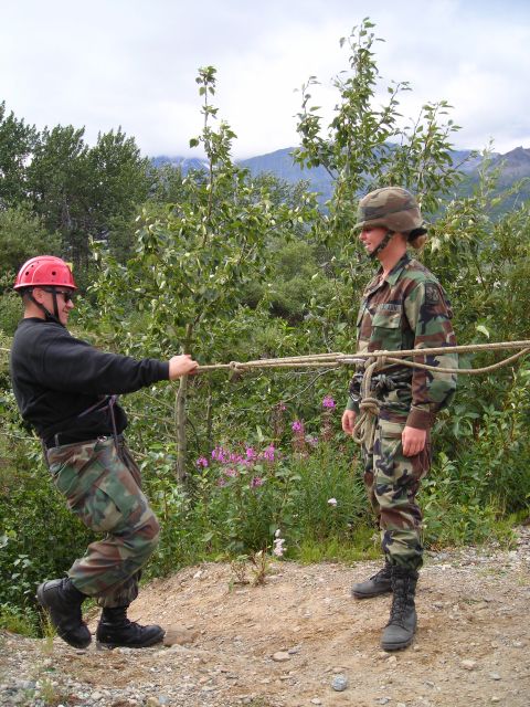 2003 Jeep TJ - Military personnel engage in rope training exercises in an outdoor environment.