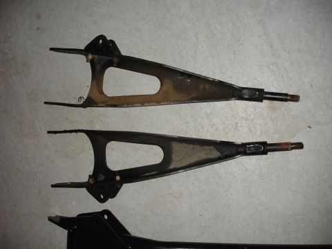 1996 Ford Bronco - Pair of suspension control arms shown before installation or after removal.