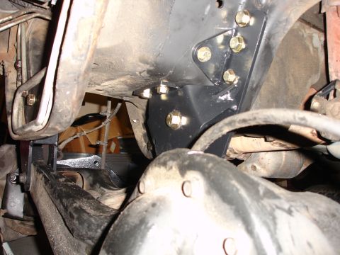 1996 Ford Bronco - Close-up view of a vehicle's suspension system with newly installed lift kit components.