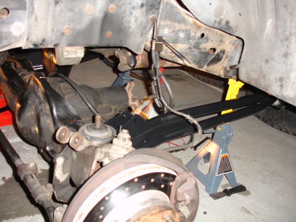 Underbody suspension and brake components on jack stands