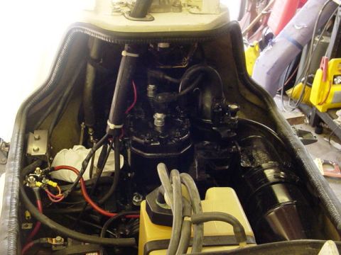 1995 Ford Mustang - Engine compartment of a personal watercraft, showing the motor and associated plumbing and wiring.
