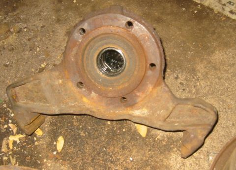 1995 Ford Bronco - This rusty front axle knuckle shows the bearing race and mounting holes.