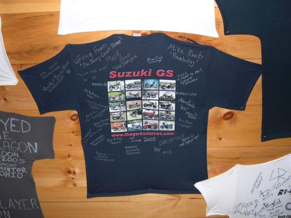 Dark t-shirt with a grid of Suzuki GS motorcycle photos and handwritten signatures and text, dated June 2005
