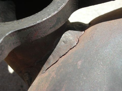 1992 Ford Crown Victoria - This metal part has a significant crack, indicating potential failure.