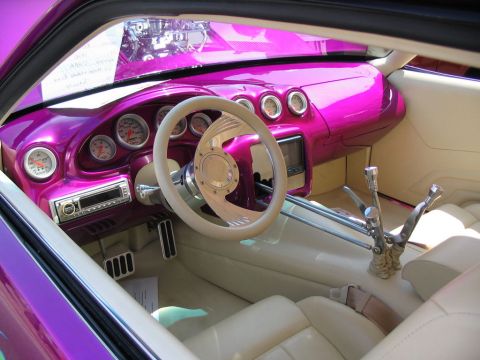 1993 Ford Taurus - Interior view of a heavily modified car with custom gauges and a unique steering wheel.