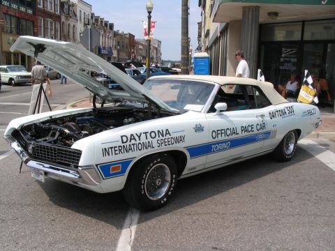 1993 Ford Taurus - 1969 Ford Torino GT Convertible pace car for Daytona 500, hood open showing engine.