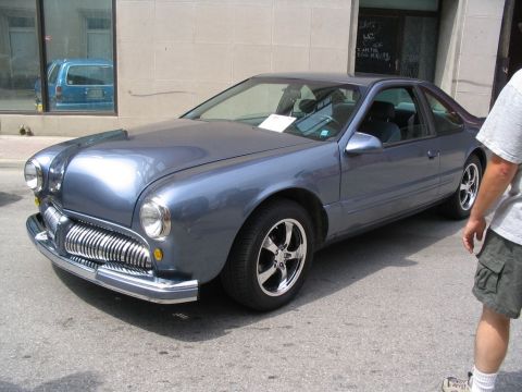 1993 Ford Taurus - This custom coupe features a unique front end that blends modern and classic styling elements.