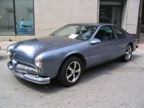 1993 Ford Taurus - This heavily modified car features a unique front end with styling cues from multiple eras.