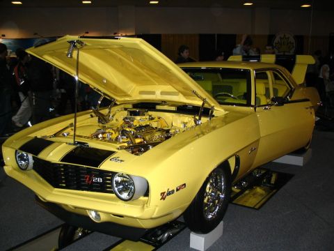 1993 Ford Taurus - This yellow 1969 Chevrolet Camaro Z28 features black racing stripes and its hood is open to display the engine.