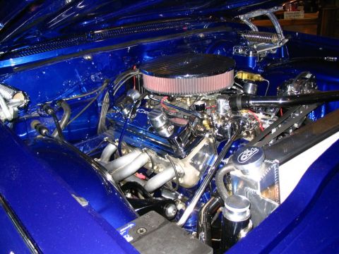 1993 Ford Taurus - Customized engine bay features a polished V8 engine with chrome accents and a large air intake.