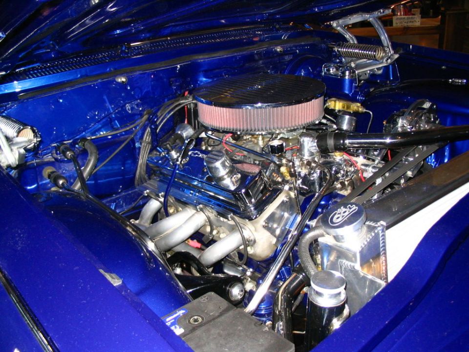 Blue engine bay with chrome details and aftermarket air filter