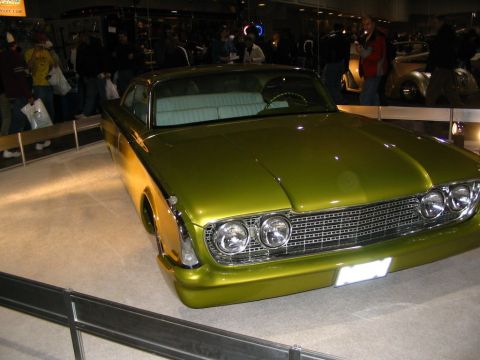1993 Ford Taurus - Customized vintage car with a unique lime green paint job on display.