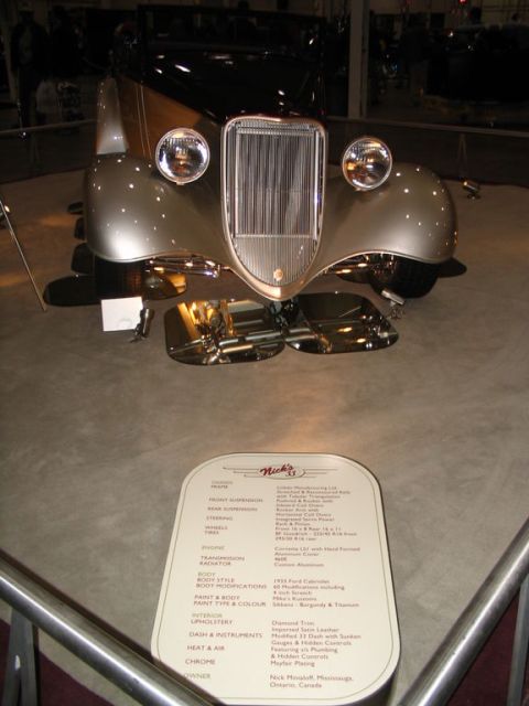 1993 Ford Taurus - A vintage 1933 Ford Cabriolet is displayed with its specifications for attendees to read.