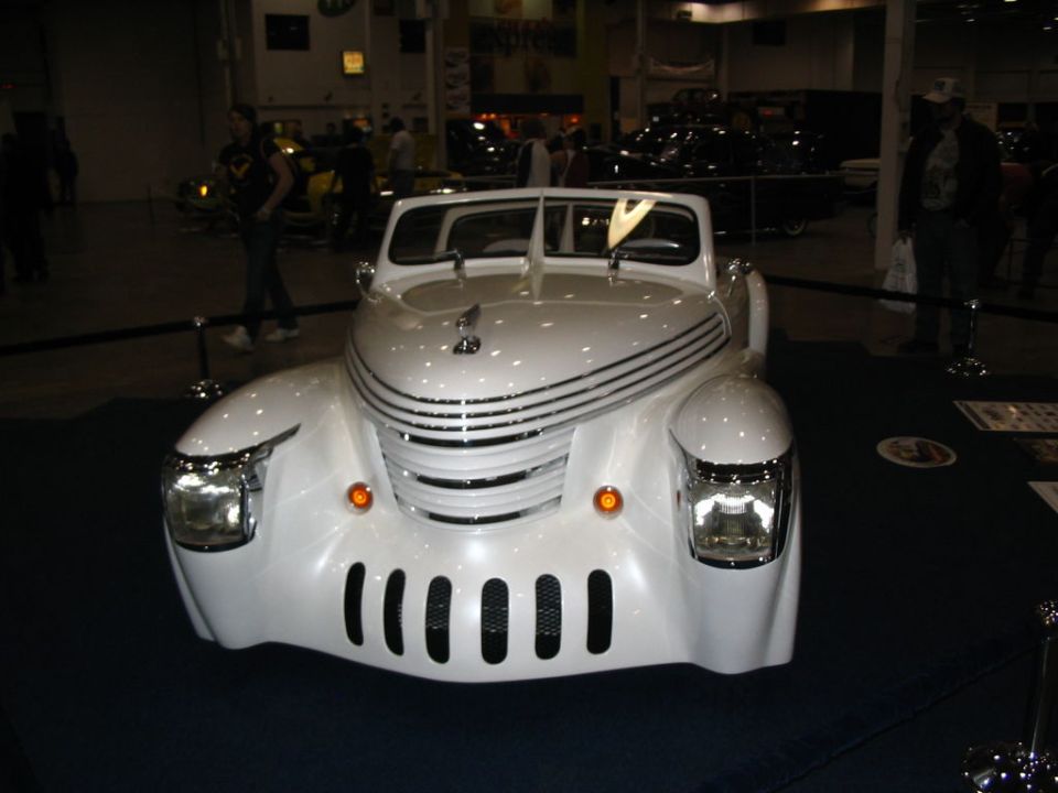 White custom hot rod front view with chrome grille and vertical slots