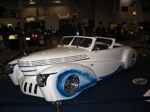 1993 Ford Taurus - Custom hot rod with distinctive wave paint on the fenders and a unique grille design.