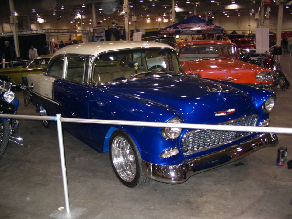 Two-tone blue and cream 1955 Chevrolet Bel Air with chrome grille and bumpers