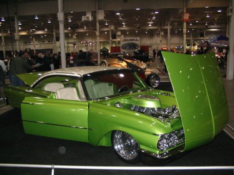 1993 Ford Taurus - This heavily modified vintage car features a bright green paint job and a custom interior.