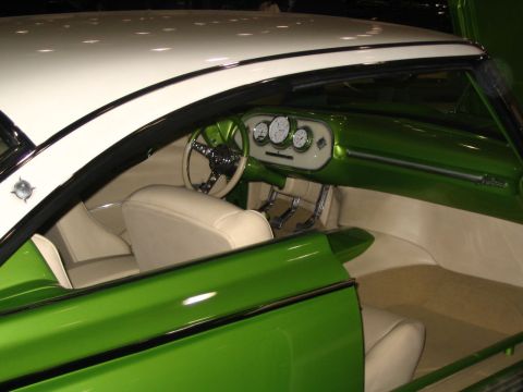 1993 Ford Taurus - Custom car interior with cream seats and green dashboard, viewed from the side with the door open.
