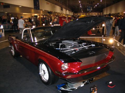 1993 Ford Taurus - This classic 1967 Ford Mustang convertible is displayed with its hood open, revealing a custom engine.