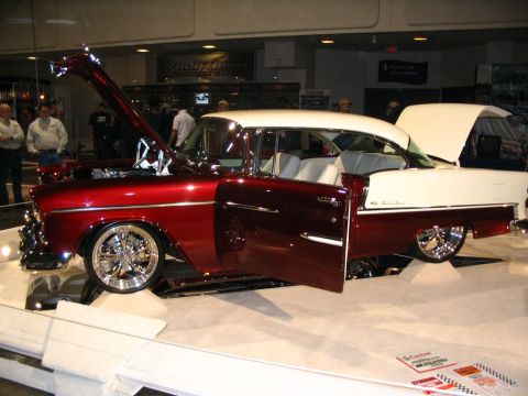 1993 Ford Taurus - A classic Chevrolet Bel Air is displayed with its hood and doors open, revealing its custom features.