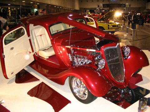 1993 Ford Taurus - Custom hot rod coupe displayed indoors, with doors and hood open, revealing its interior and engine.
