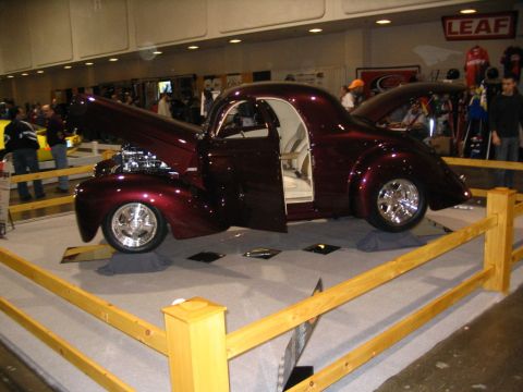 1993 Ford Taurus - Custom hot rod coupe with a custom interior and engine, displayed at a show.