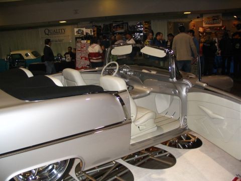 1993 Ford Taurus - Custom convertible interior with white upholstery and chrome accents on display.