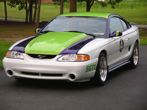 1995 Ford Mustang - This custom-painted Ford Mustang features a unique color scheme and racing-inspired decals.