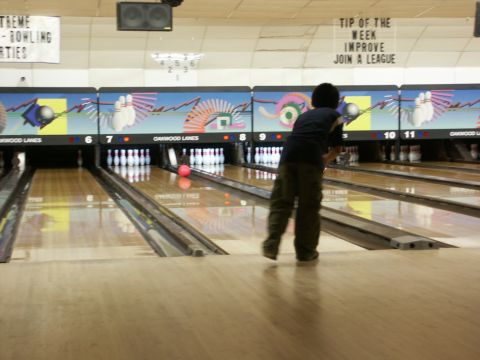 2001 Mercury Grand Marquis - A person bowls at Oakwood Lanes, with lane numbers 6 through 11 visible.