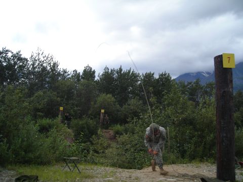 2003 Jeep TJ - A soldier practices rappelling with a rope during an outdoor training exercise.